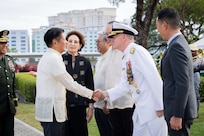 Philippine President Ferdinand R. Marcos Jr. greets Adm. Samuel J. Paparo, commander of U.S. Indo-Pacific Command, at the 80th anniversary of the Liberation of Manila at Manila American Cemetery in the Philippines, on Feb. 22, 2025. Attended by U.S. and Philippine dignitaries, the event recognized the service and sacrifice of more than 1,000 U.S. soldiers and more than 100,000 civilians who lost their lives during the fight to liberate the Philippine capital and highlighted the strength of the enduring U.S.-Philippines Alliance that has promoted peace and security in the Indo-Pacific. USINDOPACOM is committed to enhancing stability in the Indo-Pacific region by promoting security cooperation, encouraging peaceful development, responding to contingencies, deterring aggression and prevailing in conflict. (U.S. Navy photo by Chief Mass Communication Specialist Shannon M. Smith)
