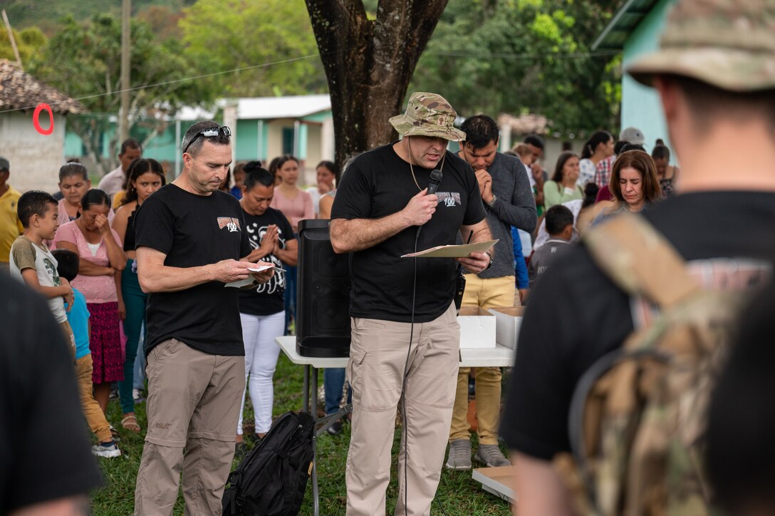U.S. Air Force Chaplain Charles Blizzard, assisted by U.S. Army Lt. Col. Wayne Hancock, J3 director, addresses the more than 200 attendees of the 100th Chapel Hike February 22, 2025 in El Llano de la Puerta, Comayagua, Honduras. The Chapel Hike, a volunteer program where service members trek to remote villages carrying essential supplies, has become synonymous with JTF-Bravo's commitment to the Honduran people.
(U.S. Air Force photo by Capt. Hillary Gibson)
