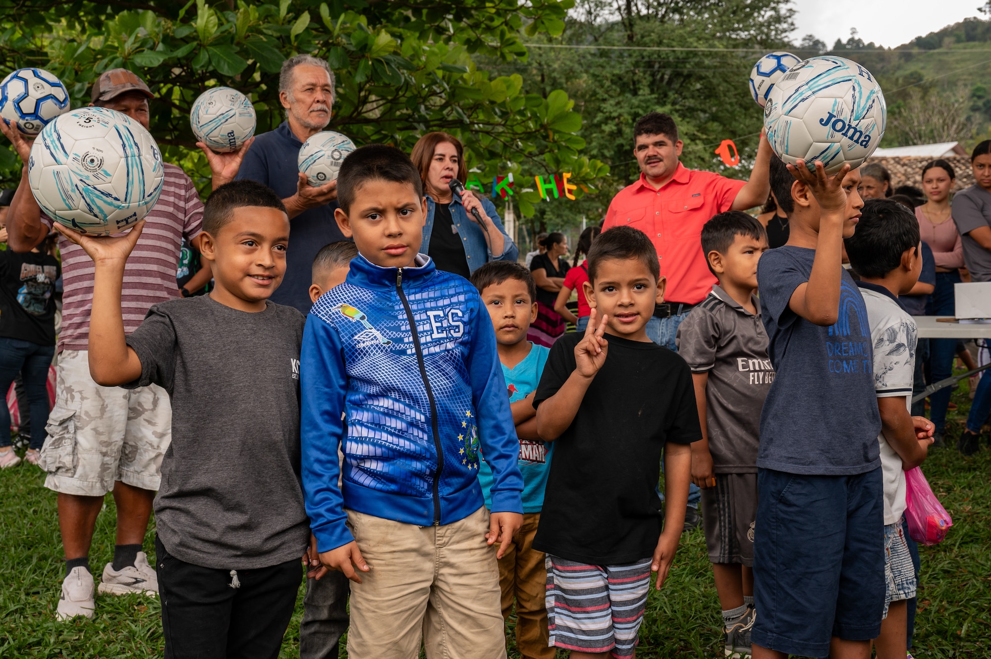Joint Task Force-Bravo members play games like soccer and pinata breaking with children attending the 100th Chapel Hike Feb. 22 in El Llano de la Puerta, Honduras. The program's impact extends far beyond the goods delivered, fostering cultural exchange and building lasting bonds between JTF-Bravo and the communities they serve.  (U.S. Air Force photo by Staff Sgt. Tristan Biese)