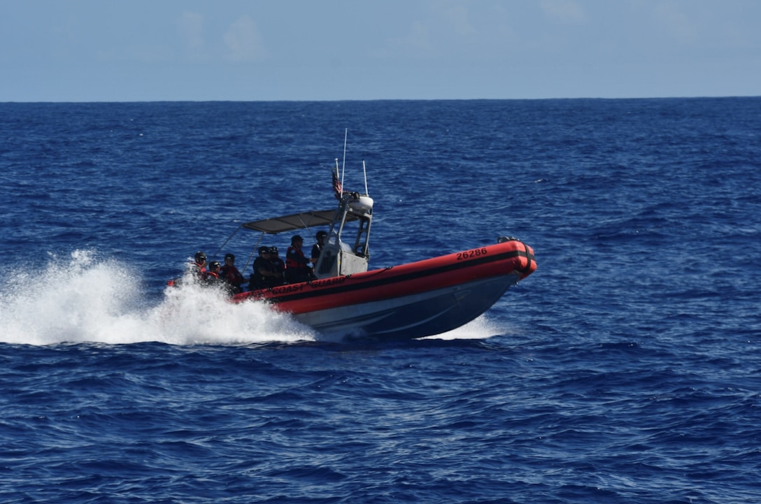 A small boat crew assigned to U.S. Coast Guard Cutter Joseph Gerczak (WPC 1126) transits to a commercial fishing vessel to conduct a boarding off the coast of American Samoa Feb. 7, 2025. During a recent law enforcement patrol, the Joseph Gerczak crew boarded two U.S.-flagged fishing vessels to ensure the territorial integrity of the U.S. maritime border and deter any threat of illicit trafficking. (U.S. Coast Guard photo by Ensign Samuel Carrol)