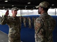 Col. Silas Darden presides over SMSgt Joshua Mayeux’s re-enlistment and recites the oath of enlistment for him to repeat following the conclusion of the training event at JBSA-Lackland, Texas on Feb. 9, 2024. (US Air Force photo by Alex Dieguez)