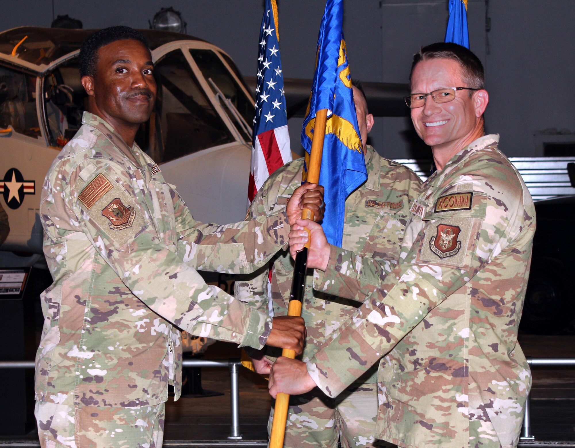 Col. Lewis “Keith” Whitehead receives the guidon from 960th Cyberspace Wing commander Col. Silas Darden during the 860th Cyberspace Operations Group change of command ceremony at Robins Air Force Base, Georgia on Sept. 14, 2024. (Courtesy photo)