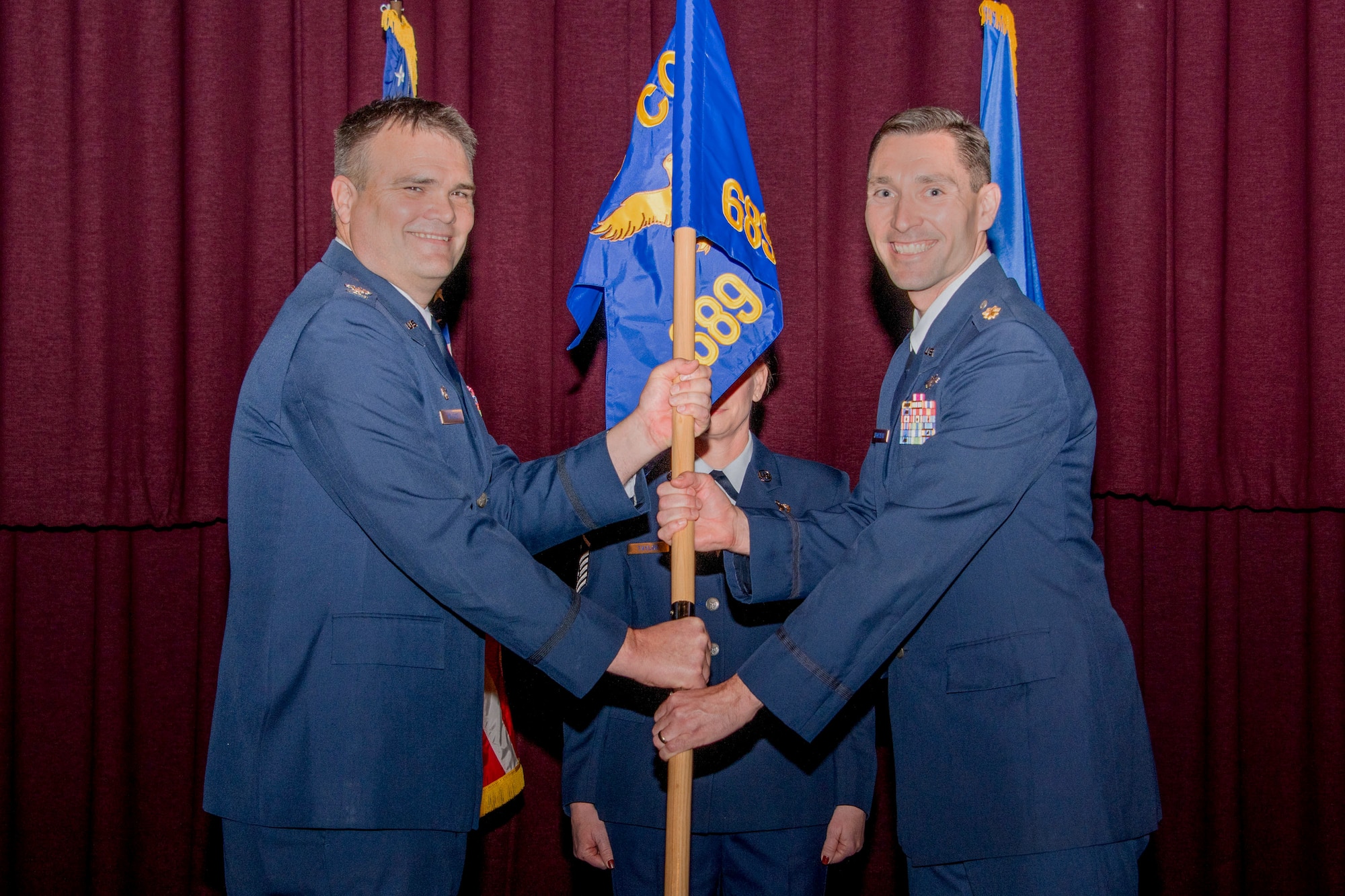 Lieutenant Colonel Jason Brosseau assumed command of the 689th Network Operations Squadron from Colonel Richard Wallace during an assumption of command ceremony at Air University’s Thomas N. Barnes Center for Enlisted Education, Maxwell Air Force Base, Alabama on Dec. 6, 2024. 