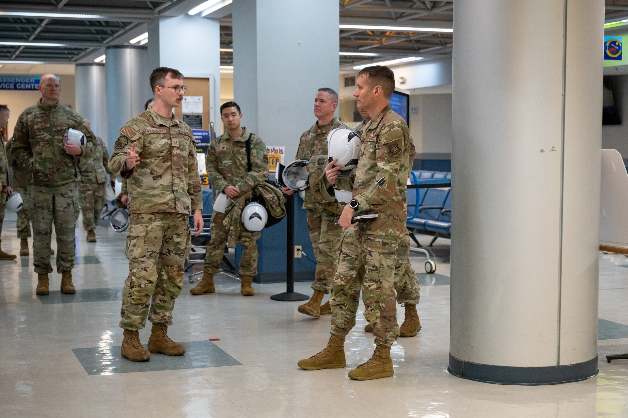 Service member speak amongst each other.