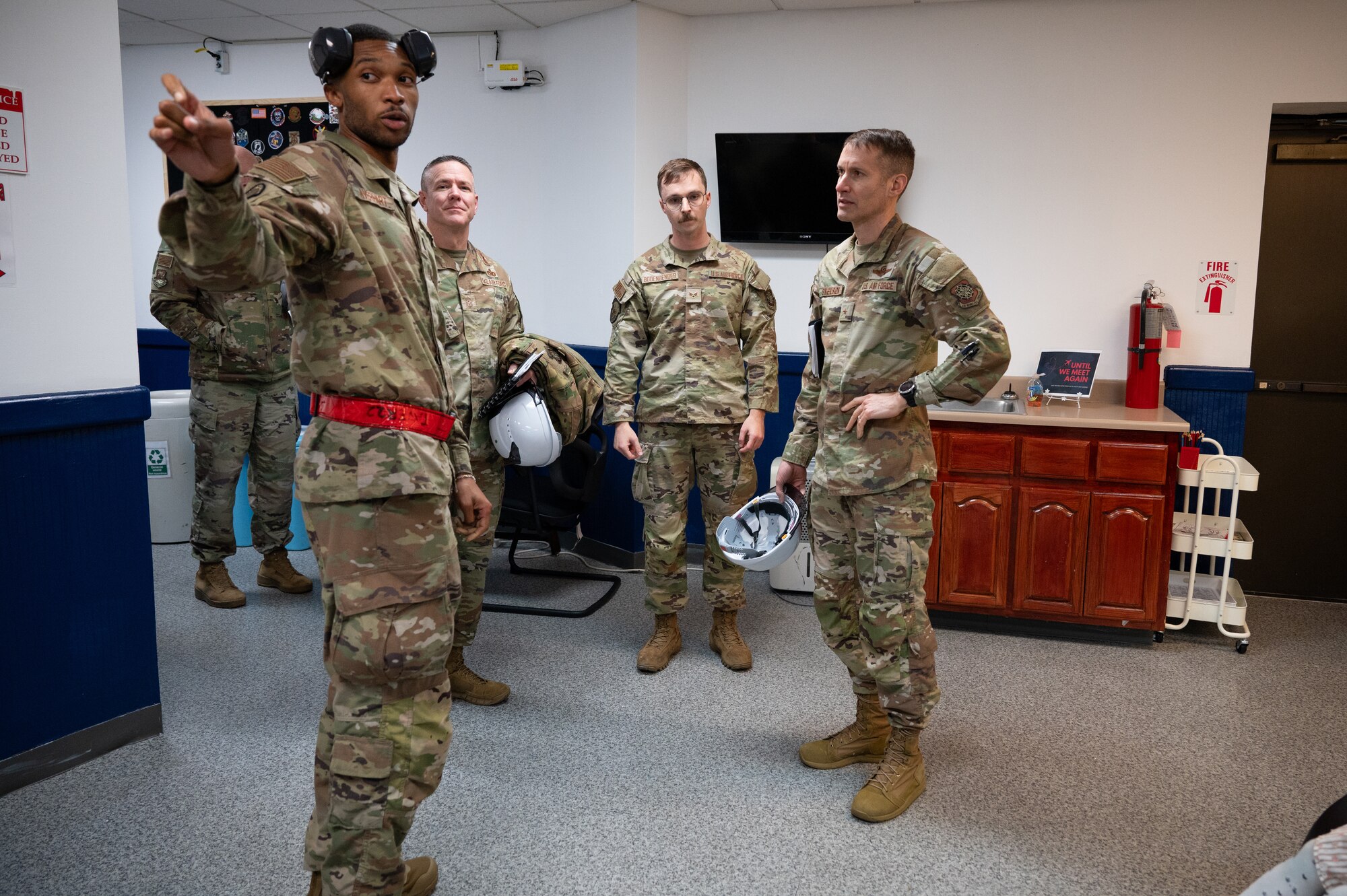 Service member speak amongst each other.