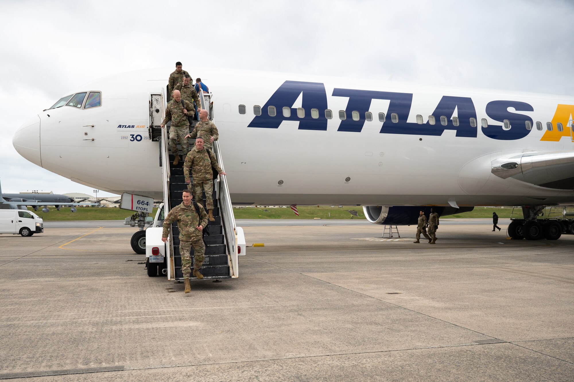Service members coming off plane.