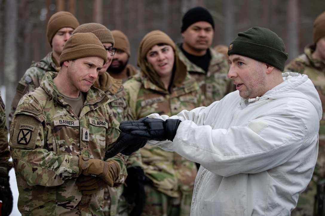 Teaching Soldiers how to set up Finnish tents