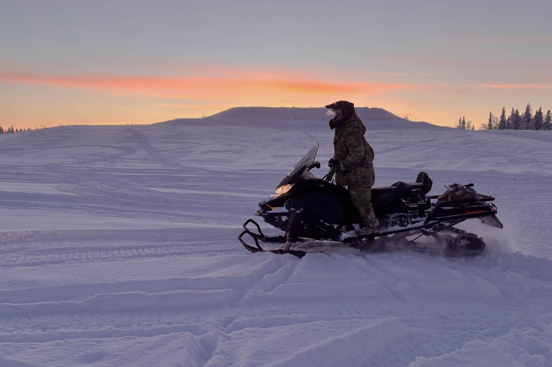 Operates a snowmobile