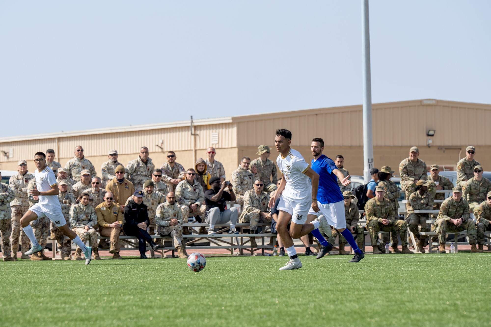 Men play soccer.