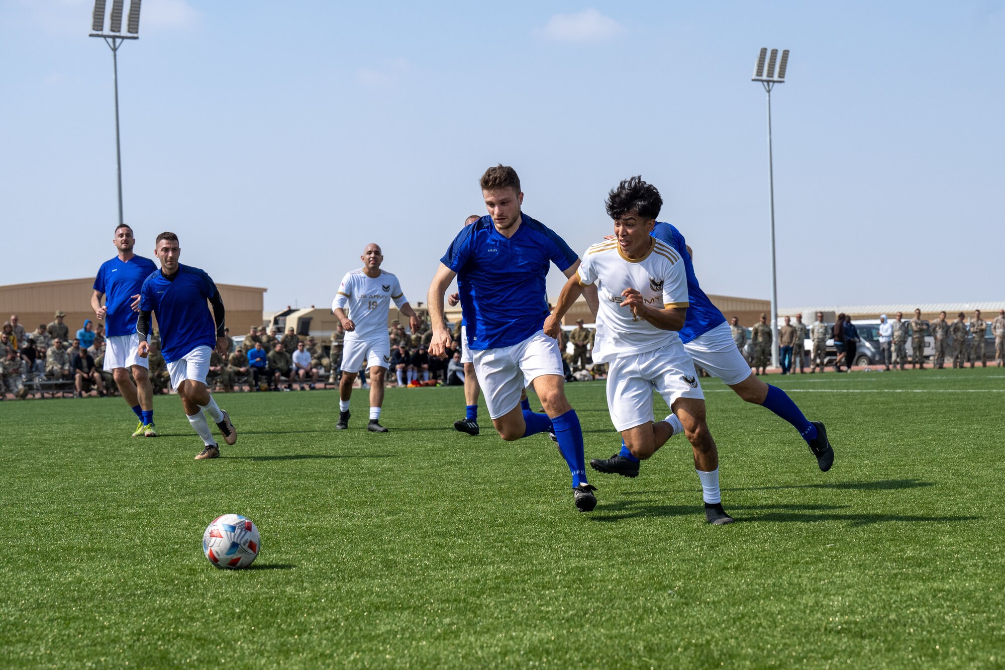 Men play soccer.