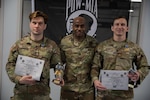 Massachusetts Army National Guard Staff Sgt. Gerald Meuse, assigned to 1st Battalion, 182nd Infantry Regiment, and New York National Guard Maj. Joshua Bennet, assigned to the 42nd Infantry Higher Headquarters Battalion, are awarded lightweight and heavyweight awards in the Minutemen competition at Camp Smith Training Site, N.Y., Feb.2, 2025. The two-day event tested military members' combat training in martial arts disciplines.