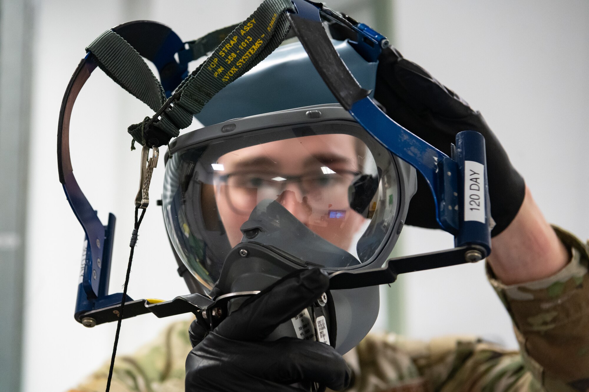 U.S. Air Force Senior Airman Jonathan Brownlee, 100th Operations Support Squadron aircrew flight equipment technician, inspects an oxygen mask at RAF Mildenhall, England, Feb. 6, 2025.