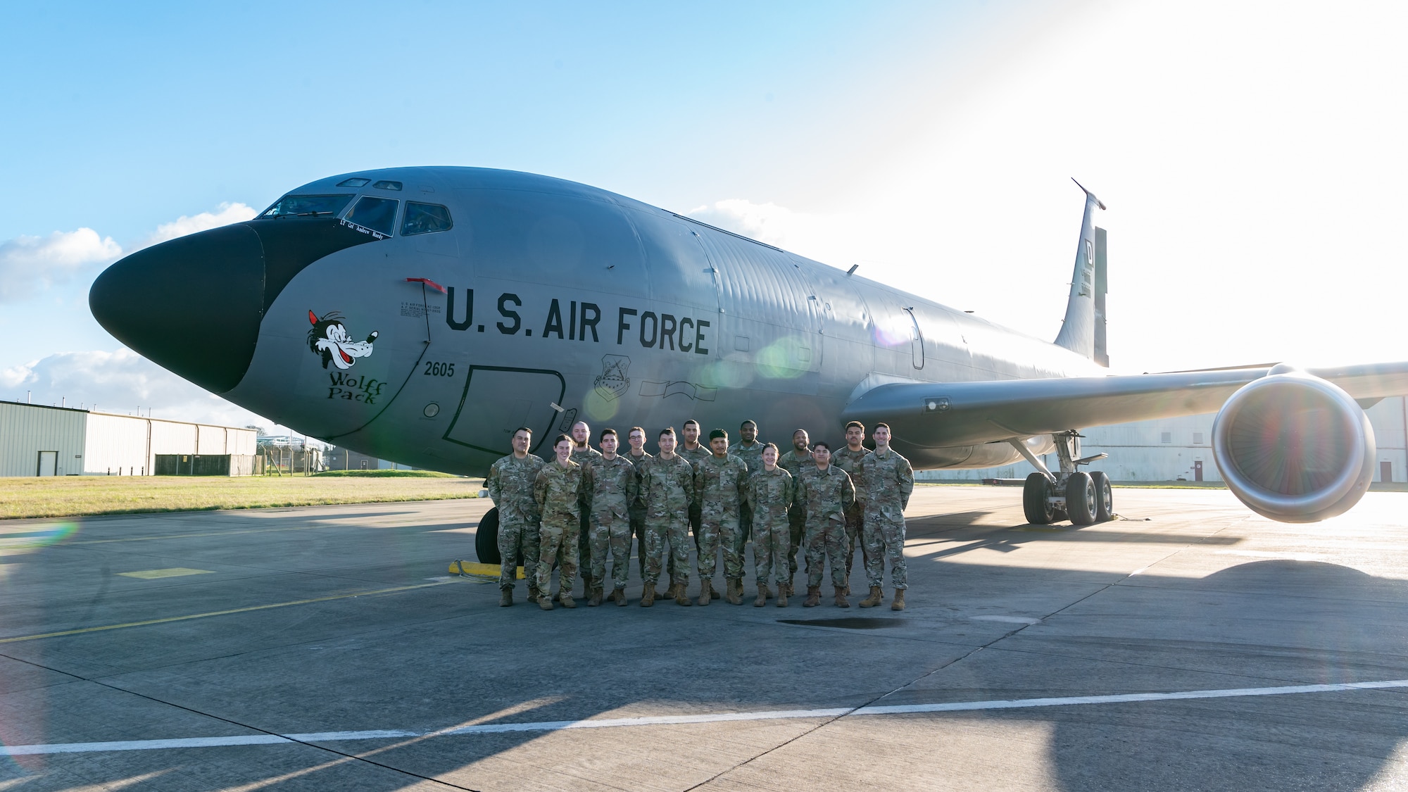 U.S. Airmen assigned to the 100th Operations Support Squadron stand next to a KC-135 Stratotanker at RAF Mildenhall, England, Feb. 6, 2025.