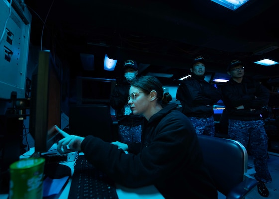 Sailors from the Japan Maritime Self-Defense Force observe operations in the combat information center aboard USS Shoup (DDG 86) during Fleet Synthetic Training-Joint (FST-J) 25-71 (Resilient Shield).