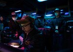 Sailors from the Japan Maritime Self-Defense Force observe operations in the combat information center aboard USS Shoup (DDG 86) during Fleet Synthetic Training-Joint (FST-J) 25-71 (Resilient Shield).