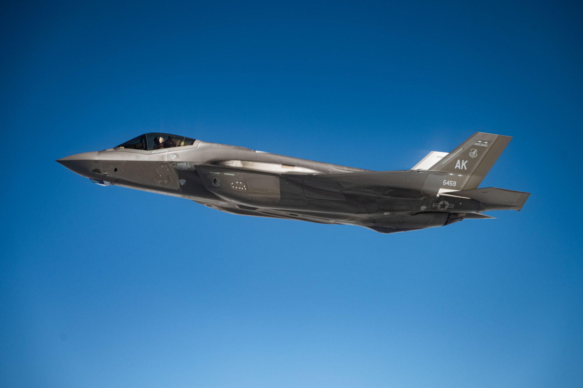 An F-35A Lightning II, assigned to the 354th Fighter Wing, flies alongside a KC-46 Pegasus during an aerial refueling mission over the Pacific Ocean as part of exercise Bamboo Eagle 25-1, Feb. 11, 2025
