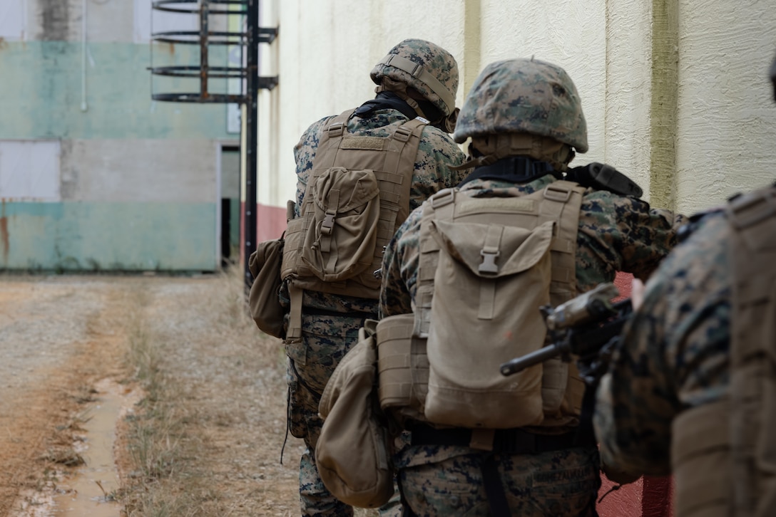 U.S. Marines with III Marine Expeditionary Force Information Group, conduct a patrol as part of close quarters combat training during the Stormbreaker 25.1 exercise on Camp Hansen, Okinawa, Japan, Jan. 29, 2025. The Stormbreaker 25.1 exercise is designed to enhance combat readiness by establishing, maintaining, and defending communication networks and services, enabling commanders to effectively command and control their forces. (U.S. Marine Corps photo by Cpl. Bridgette Rodriguez)