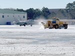 Naval Air Station Oceana public works and air operations personnel clear the installation’s airfield after a record-breaking winter snow storm.