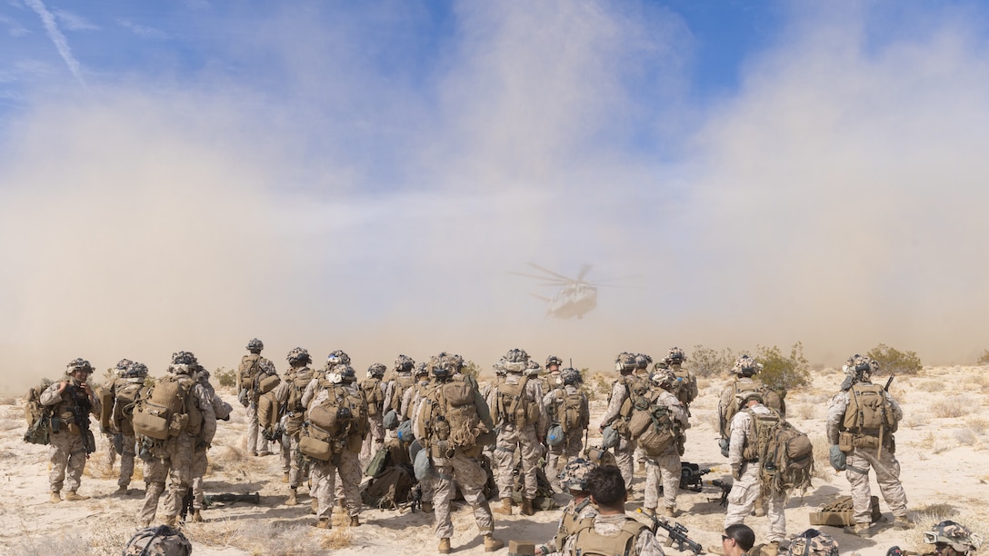 U.S. Marines with 4th Marine Division prepare to embark a CH-53E Super Stallion during a battalion urban assault as part of an Adversary Force Exercise (AFX) at Marine Corps Air-Ground Combat Center Twentynine Palms, California, Feb. 7, 2025. AFX is the primary readiness-building event leading to the battalion’s upcoming deployment to Okinawa, Japan, as part of the Marine Corps’ Unit Deployment Program. The exercise served as an opportunity to receive training across all warfighting functions in a realistic and fully resourced environment. (U.S. Marine Corps photo by Cpl. Earik Barton)