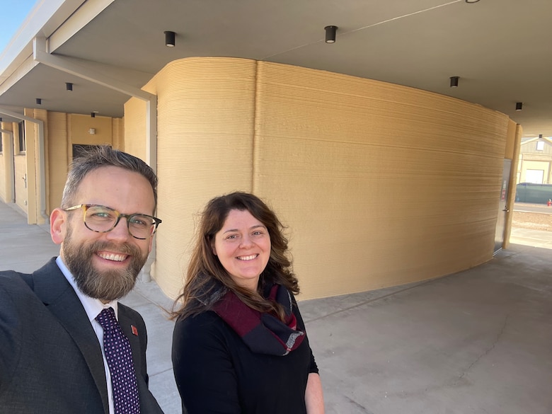 ERDC-CERL Director Andy Nelson and Additive Construction Portfolio Manager Megan Kreiger with the lasted 3D-printed barracks in the DoD
