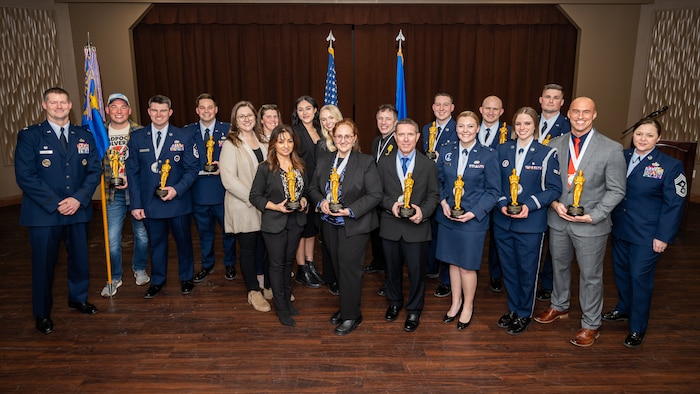 Military and civilian award winners pose with their trophies
