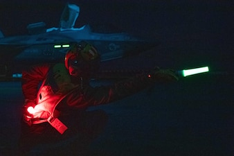 ABH1 Jaquan Morgan launches an F-35B Lightning II from VMFA-242 during flight operations aboard USS America (LHA 6) in the Philippine Sea.