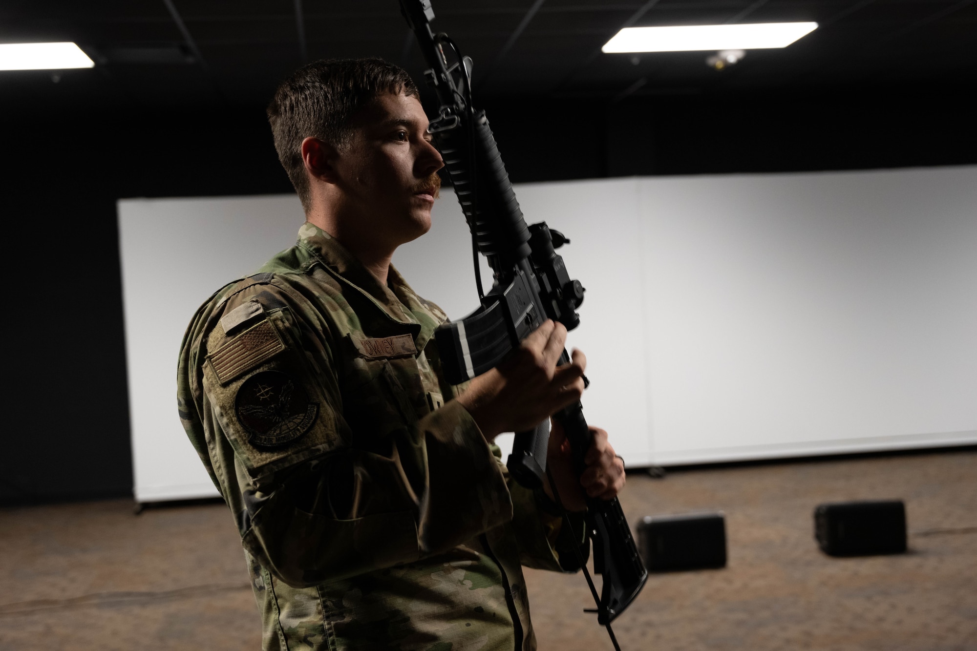 A U.S Airman shows weapon safety for a M4 Carbine.