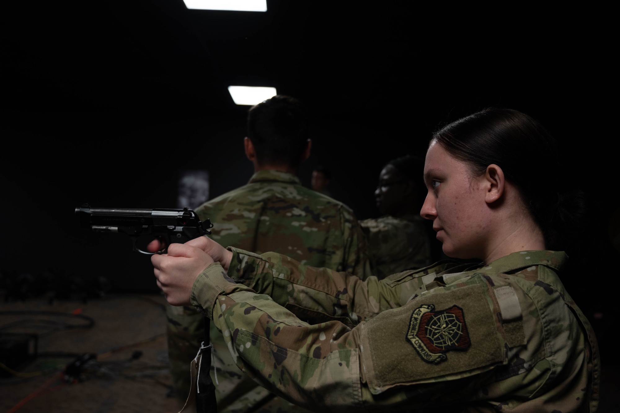 U.S Airman stands ready with simulator weapon.