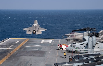 An F-35B Lightning II fighter aircraft from VMFA-242 takes off from USS America (LHA 6) during flight operations in the Philippine Sea.