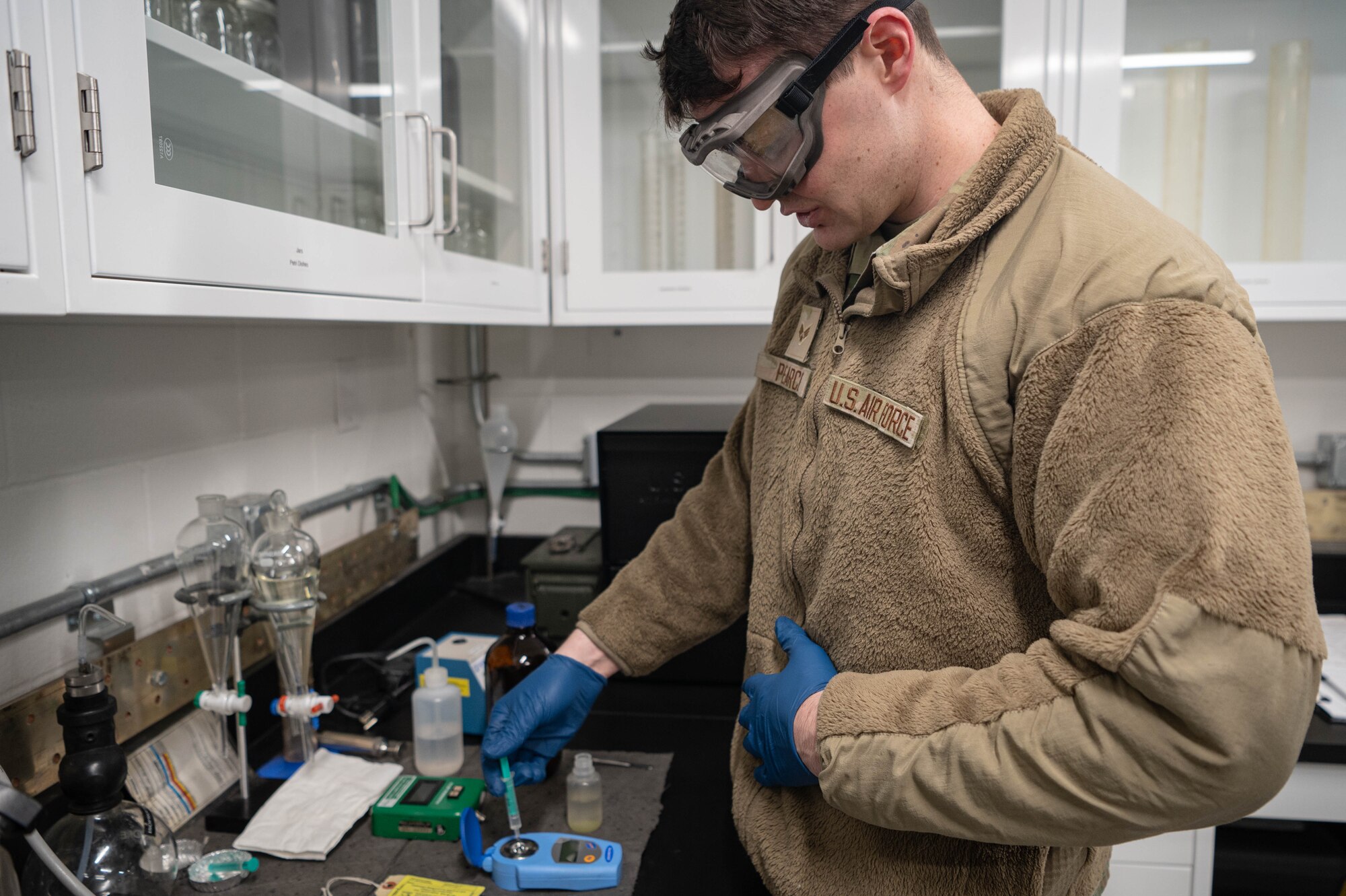 Senior Airman Devon Pearce, 55th Logistics Readiness Squadron fuel laboratory technician, prepares a jet fuel sample for testing Feb. 21, 2025. Testing is done to ensure there are no impurities or contaminants that may affect performance.