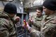 (From left to right) Airman 1st Class Erik Cruz, Staff Sgt. Micheal Villarreal and Master Sgt. Matthew Yordt, all heating, ventilation, air conditioning and refrigeration specialists assigned to the 5th Civil Engineer Squadron, use a voltmeter on an air switch to troubleshoot a furnace at Minot Air Force Base, North Dakota, Feb. 19, 2025. At locations like Minot AFB, where the winters can reach dangerously low temperatures, HVAC/R military and civilian engineers sustain critical heating systems. (U.S. Air Force photo by Senior Airman Kendra A. Ransum)