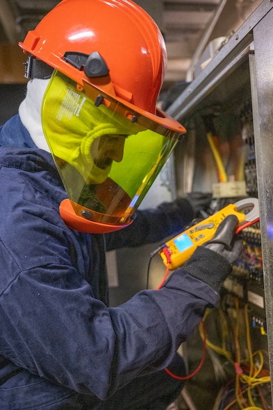 Senior Airman Payton Jones, a 5th Civil Engineer Squadron heating, ventilation, air conditioning and refrigeration specialist, troubleshoots an electrical issue on a high-voltage chiller at the Flight Simulation Training building on Minot Air Force Base, North Dakota, Feb. 19, 2025. HVAC/R personnel service a variety of equipment, including electrical units, boilers, chillers, furnaces and air compressors. (U.S. Air Force photo by Senior Airman Kendra A. Ransum)
