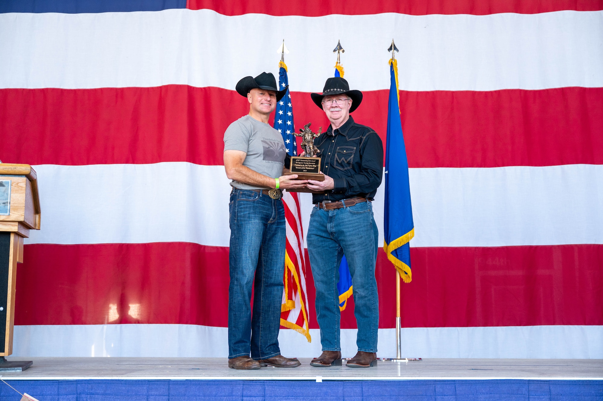 Retired U.S. Air Force Maj. Gen. John Berry (right), Air Force Historical Foundation chair, presents the Hap Arnold Thunderbolt award to U.S. Air Force Brig. Gen. David Berkland (left), 56th Fighter Wing commander, during the 2025 annual awards ceremony, Feb. 21, 2025, at Luke Air Force Base, Arizona.