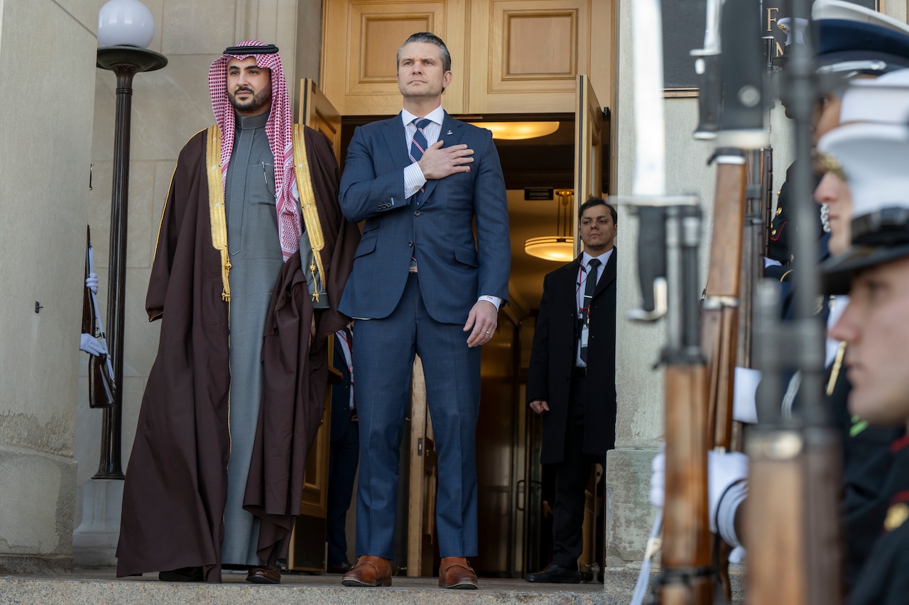 The U.S. defense secretary and Saudi Arabia's minister of defense stand on the steps on the Pentagon during a bilateral exchange.