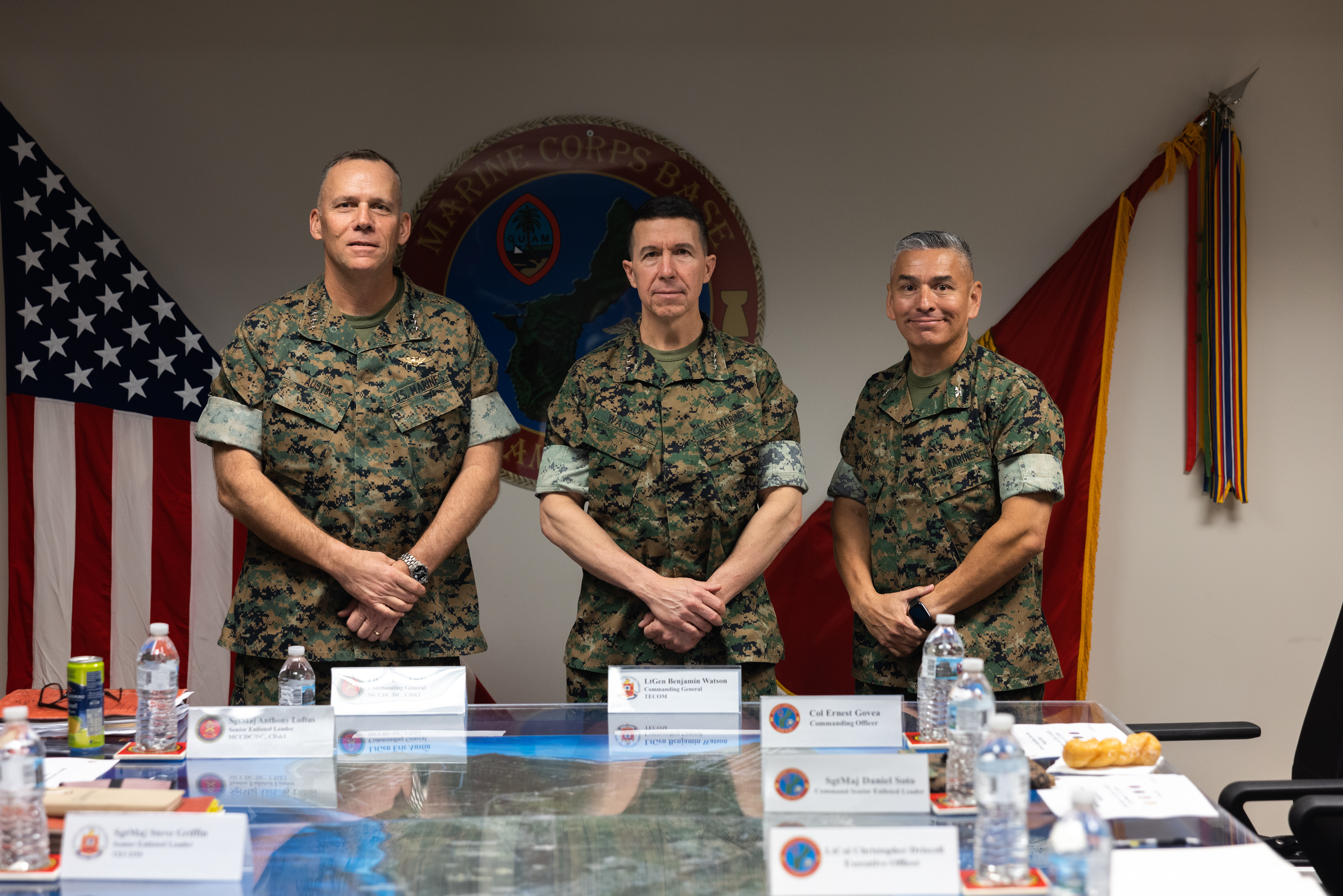 U.S. Marine Corps Lt. Gen. Eric Austin, commanding general, Marine Corps Combat Development Command, Lt. Gen. Benjamin T. Watson, commanding general, Marine Corps Training and Education Command, and Col. Ernest Govea, commanding officer, Marine Corps Base Camp Blaz, pose for a group photo on MCB Camp Blaz, Guam, Feb. 11, 2025. Senior Marine Corps' leadership visited Camp Blaz to see the progress of the base’s development and capabilities. (U.S. Marine Corps photo by Cpl. Brayden Daniel)