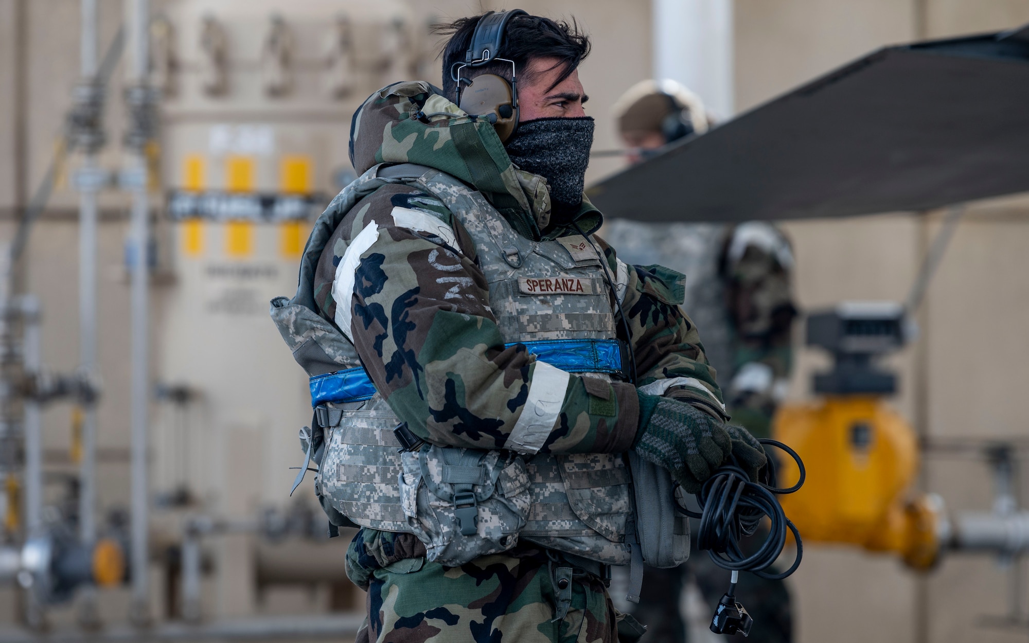 U.S. Air Force Senior Airman Robert Speranza, 36th Fighter Generation Squadron, secures cables during Beverly Herd 25-2 at Kunsan Air Base, Republic of Korea, Jan. 29, 2025. Members from Osan AB operated in inclement weather to maintain F-16 Fighting Falcons in a show of agile combat employment capabilities during exercise Beverly Herd 25-2. (U.S. Air Force photo by Staff Sgt. Ashley N. Mikaio)