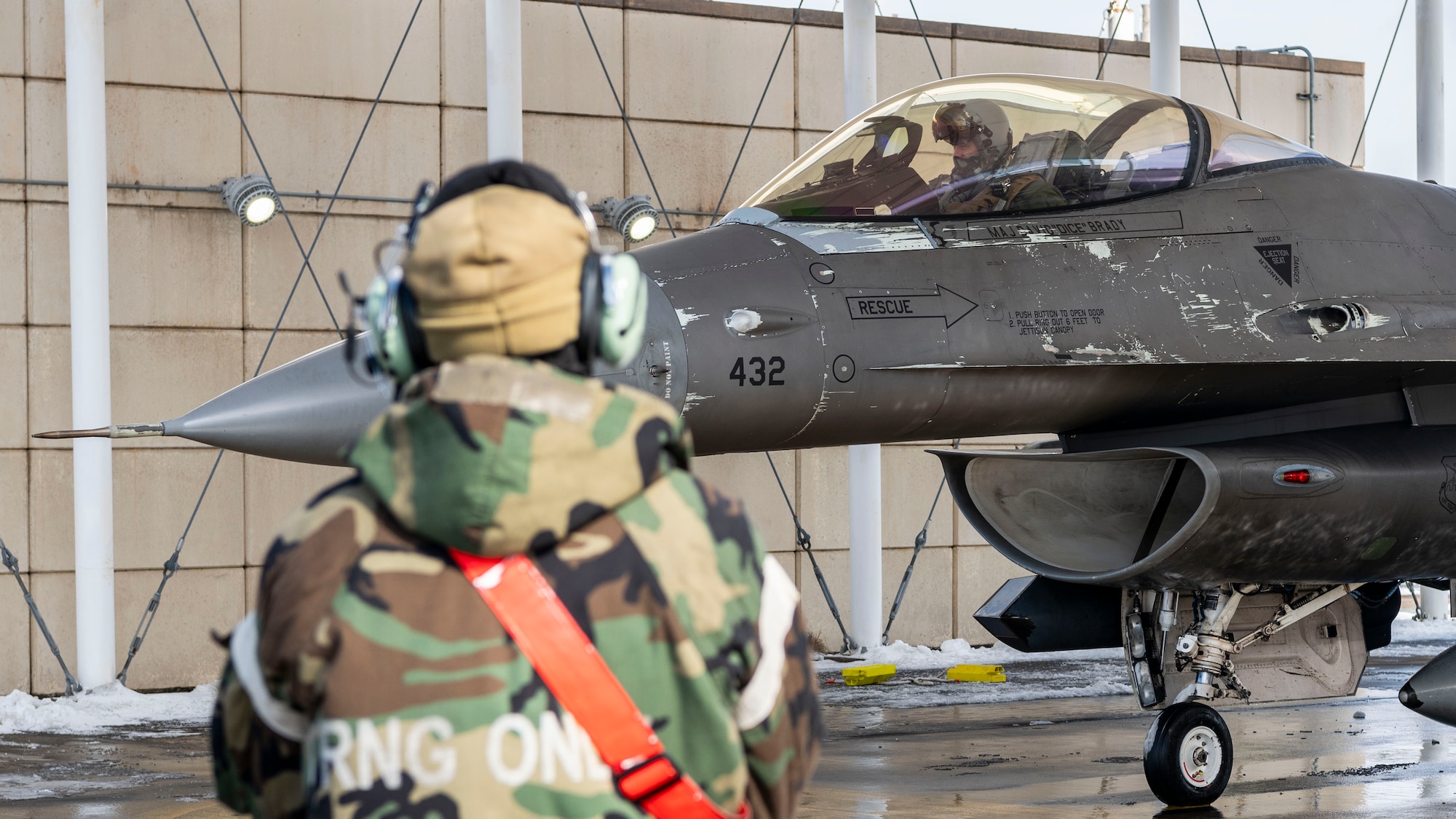 A U.S. Air Force 36th Fighter Generation Squadron crew chief signals to a U.S. Air Force 36th Fighter Squadron F-16 Fighting Falcon pilot before a flight at Kunsan Air Base, Republic of Korea, Jan. 29, 2025. The F-16s arrived in support of Beverly Herd 25-2 agile combat employment dispersal exercise. ACE uses a network of smaller dispersed locations to combat adversary threats and maintain air power operations. (U.S. Air Force photo by Staff Sgt. Ashley N. Mikaio)