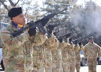 A U.S. Army honor guard detail fires their rifles during the 74th anniversary of the Battle of Bayonet Hill Commemoration Ceremony held at Osan Air Base, South Korea, Feb. 20, 2025.