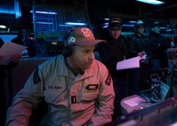 Sailors from the Japan Maritime Self-Defense Force observe operations in the combat information center aboard USS Shoup (DDG 86) during Fleet Synthetic Training-Joint (FST-J) 25-71 (Resilient Shield).
