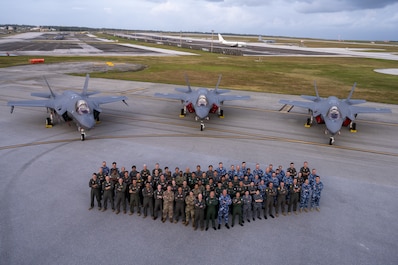 ANDERSEN AIR FORCE BASE, Guam (Feb. 21, 2025) — Allies from the United States, Japan and Australia come together for a group photo on the flight-line in front of three F-35A Lightning IIs to celebrate the end of exercise Cope North 2025 at Andersen Air Force Base, Guam, Feb. 21, 2025. CN25 is a multinational, U.S. Pacific Air Forces-sponsored, field training exercise focused on conducting Combat Air Force training to increase interoperability. This exercise enhances U.S. relationships and interoperability with our regional Allies and partners by fostering the exchange of information and refining shared tactics, techniques and procedures to better integrate multilateral defense capabilities and compatibility in support of regional security. ( U.S. Air Force photo by Airman 1st Class Tala Hunt)