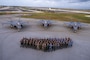 Allies from the United States, Japan and Australia come together for a group photo on the flight-line in front of three F-35A Lightning IIs to celebrate the end of exercise Cope North 2025 at Andersen Air Force Base, Guam, Feb. 21, 2025.