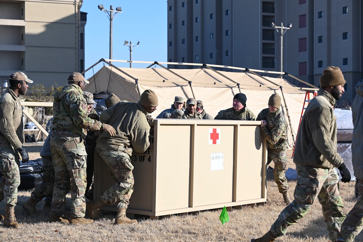 Airmen from the 8th Medical Group move a medical container during an expeditionary medical support health response team training at Kunsan Air Base, Republic of Korea.