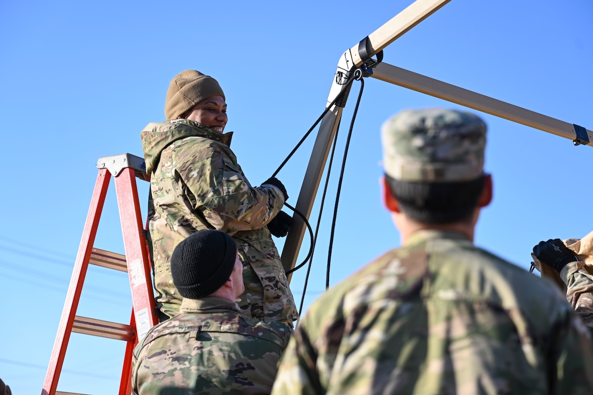 U.S. Air Force Master Sgt. Deloran Lomax, 8th Healthcare Operations Squadron senior enlisted leader, secures the frame of a medical tent during an expeditionary medical support health response team training at Kunsan Air Base, Republic of Korea.