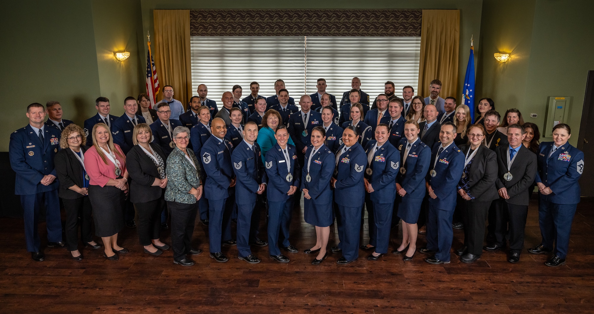 A large group photo of military and civilian award nominees