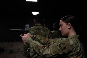 U.S Airman stands ready with simulator weapon.