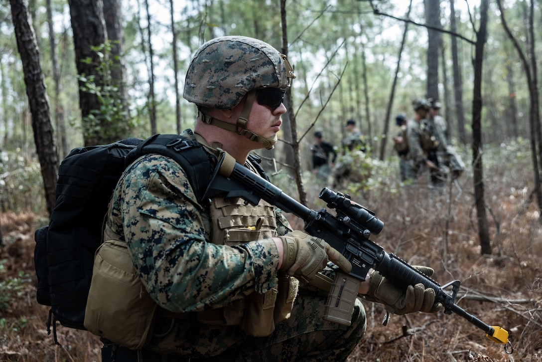 U.S. Marine Corps Staff Sgt. Kevin Allen, a criminal investigator with the 22nd Marine Expeditionary Unit, sets security during a simulated raid as part of Marine Air-Ground Task Force (MAGTF) Interoperability Exercise on Marine Corps Base Camp Lejeune, North Carolina, Feb. 5, 2025. The raid is one of several training events within MAGTF Interoperability, a course conducted by Expeditionary Operations Training Group. This course is designed to evaluate integrated elements of the 22nd MEU across a variety of full mission profiles in a simulated peer threat environment. (U.S. Marine Corps photo by Sgt. Nathan Mitchell)