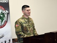 Capt. Andrew Whittenbarger speaks during a change of command ceremony Feb. 21 at Fort Detrick, Maryland. Whittenbarger passed command of the U.S. Army Medical Materiel Agency’s Headquarters and Headquarters Detachment, or HHD, to Capt. Paul Abucher.