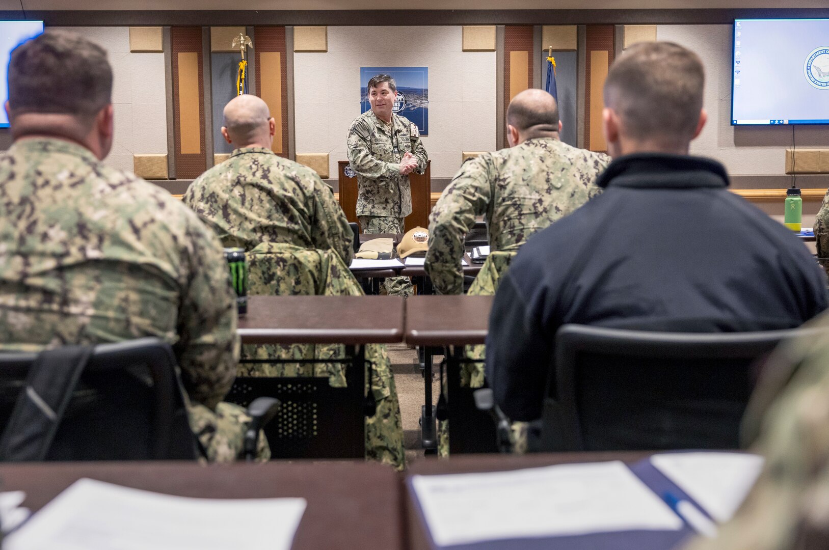 Capt. JD Crinklaw, commander, Puget Sound Naval Shipyard & Intermediate Maintenance Facility, welcomes a group of approximately 90 SurgeMain Sailors Feb. 2, during a briefing at Olympic Lodge at Naval Base Kitsap-Bremerton, Washington, in preparation for the Reservists' annual two-week training deployment at PSNS & IMF. (U.S. Navy photo by Wendy Hallmark)