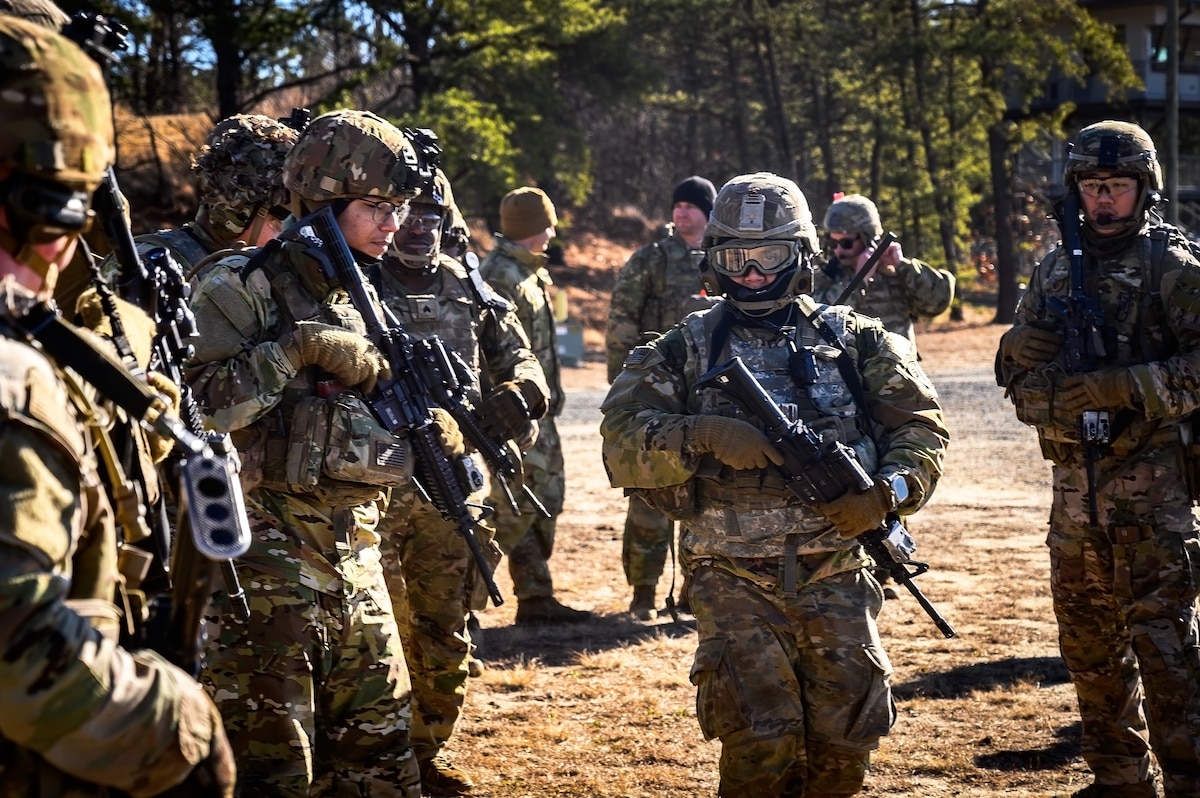 U.S. Army Soldiers assigned to the 1-102nd Infantry Regiment, mobilize during a platoon live-fire exercise at Joint Base McGuire-Dix-Lakehurst, N.J., Feb. 1, 2025. The platoon live-fire exercise incorporated land navigation through indirect fire and utilized unmanned aerial vehicle systems for both reconnaissance and offensive maneuvers. (U.S. Air Force photo by Senior Airman Matt Porter)