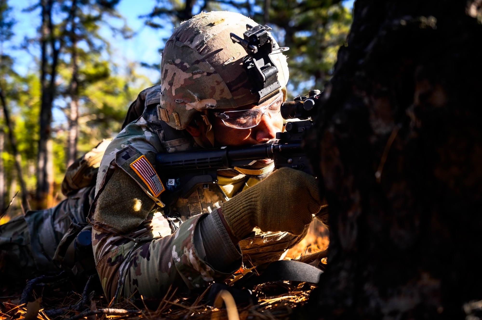 U.S. Army Sgt. Kyrie Johnson, 1-102nd Infantry Regiment infantryman, provides overwatch during a platoon live-fire exercise at Joint Base McGuire-Dix-Lakehurst, N.J., Feb. 1, 2025. The platoon live-fire exercise incorporated land navigation through indirect fire and utilized unmanned aerial vehicle systems for both reconnaissance and offensive maneuvers. (U.S. Air Force photo by Senior Airman Matt Porter)